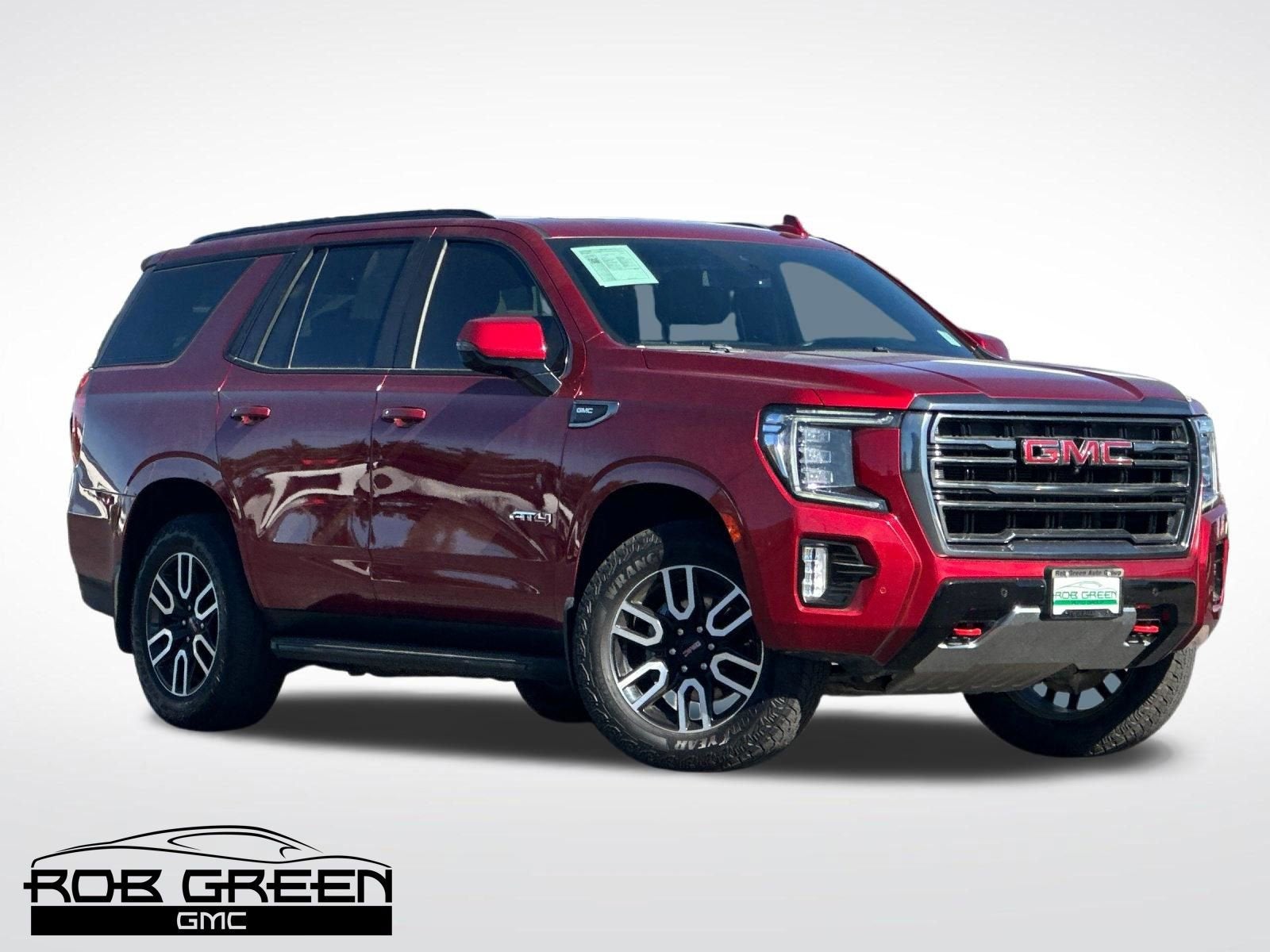 2023 GMC Yukon AT4 in Volcanic Red Tintcoat — front three-quarter view