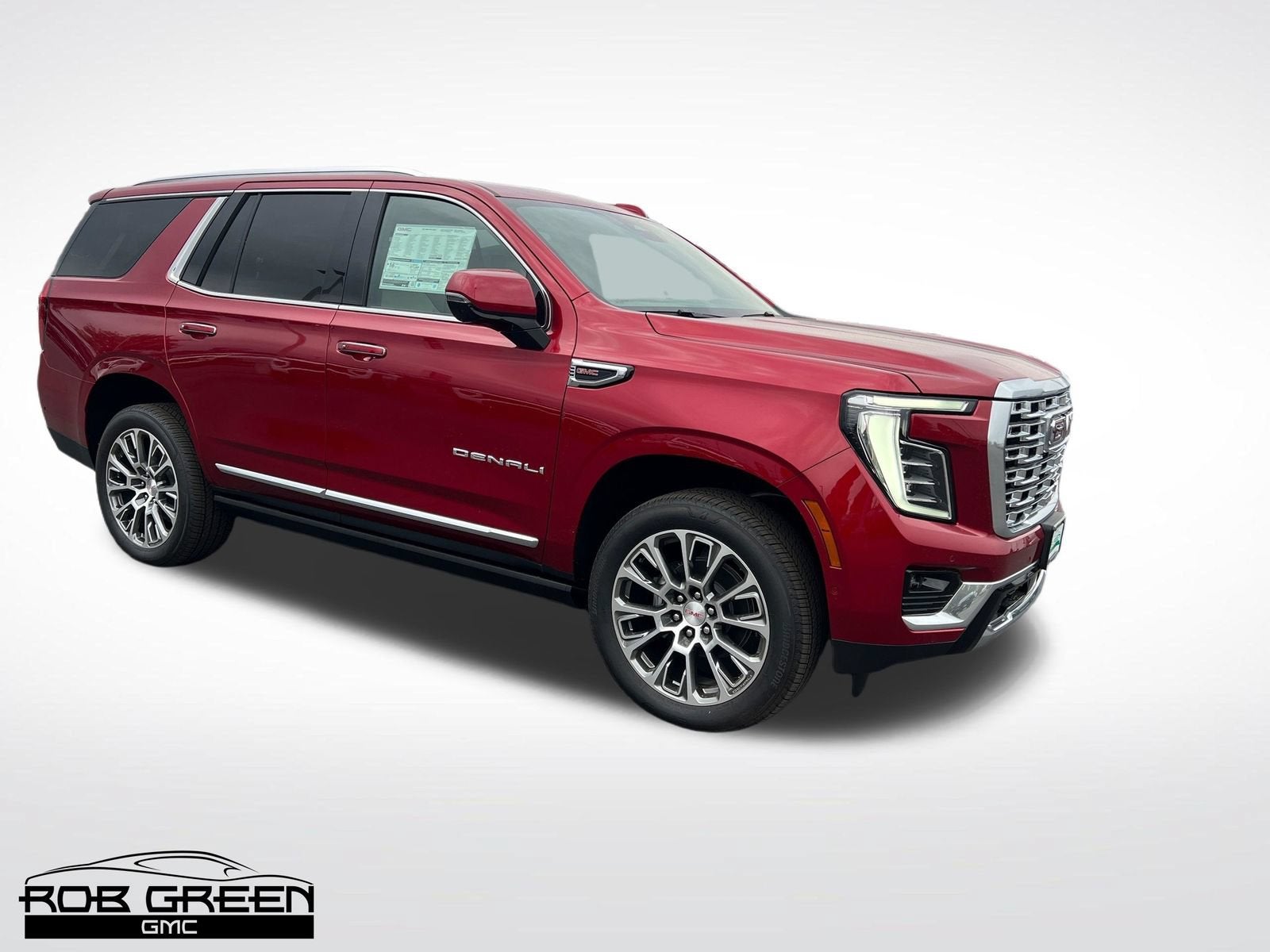2026 GMC Yukon Denali in Volcanic Red Tintcoat — front three-quarter view