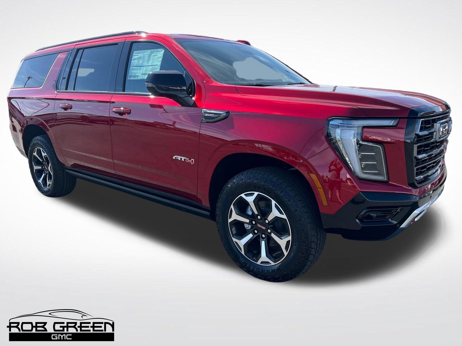2026 GMC Yukon XL AT4 in Volcanic Red Tintcoat — front three-quarter view