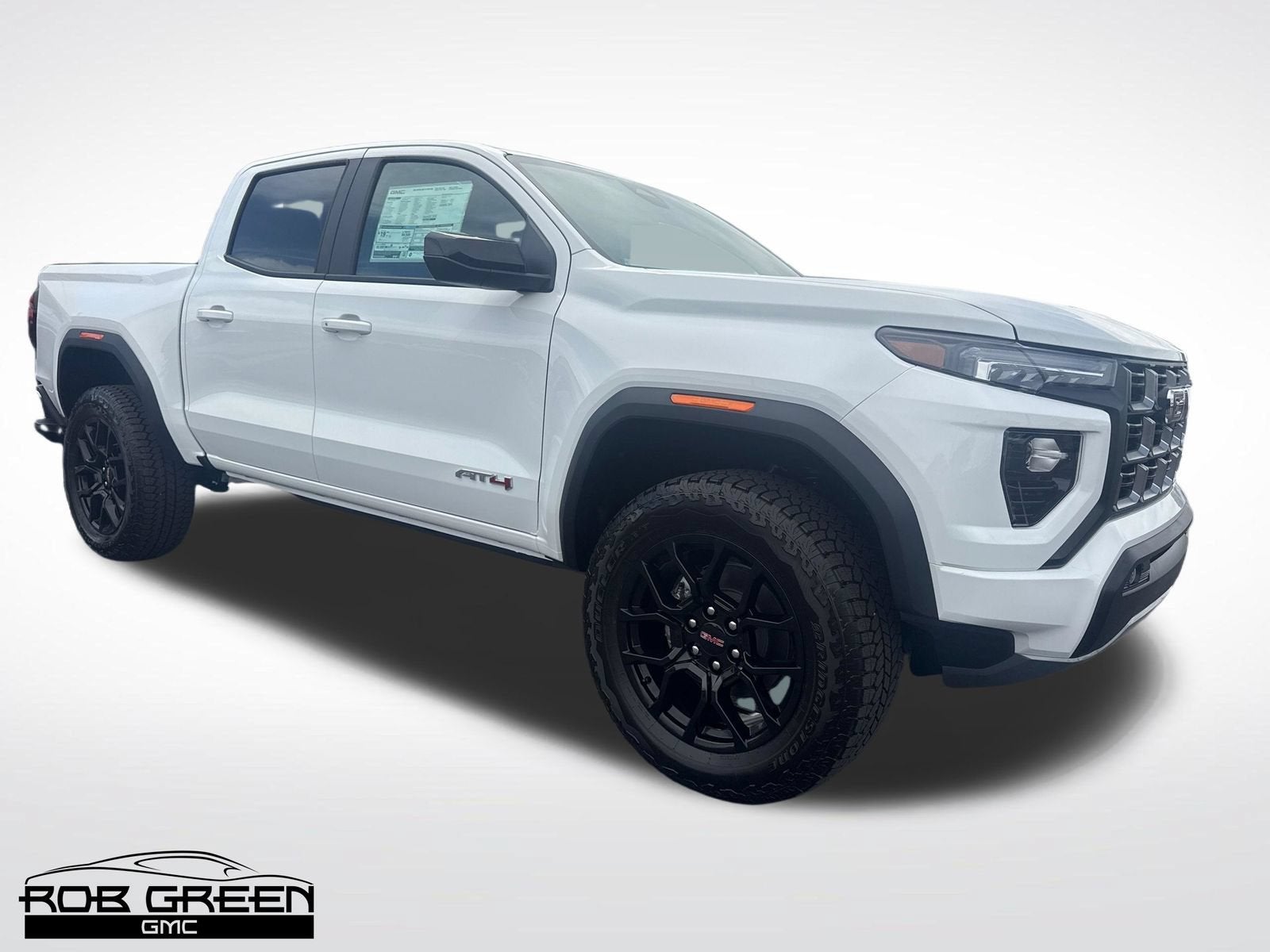 2026 GMC Canyon AT4 in Summit White — front three-quarter view