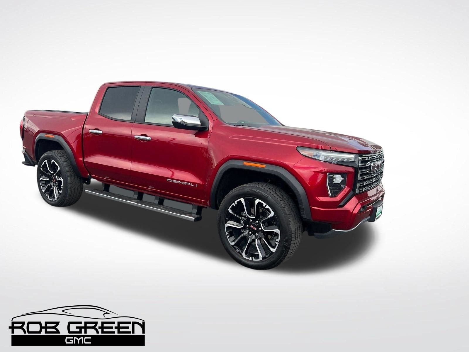 2026 GMC Canyon Denali in Volcanic Red Tintcoat — front three-quarter view